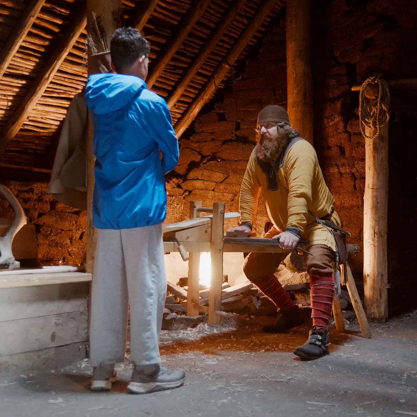 Viking staff at L&rsquo;Anse aux Meadows talking to a boy